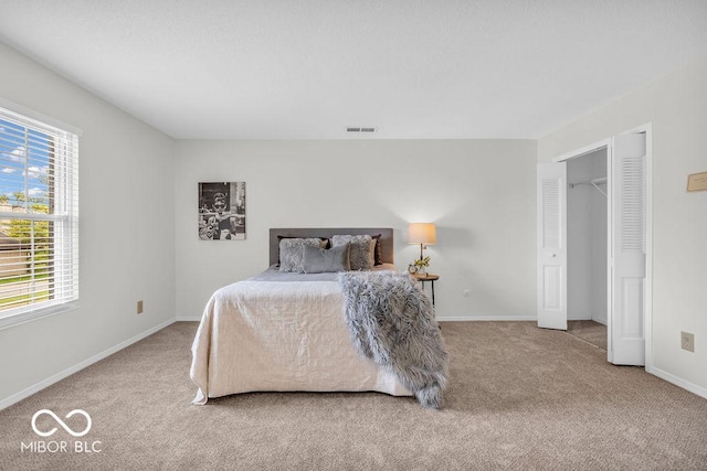 1632 Queensbridge Sq Unit 7, Indianapolis, IN 46219 - bedroom featuring carpet, multiple windows, and baseboards