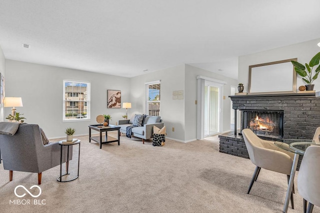 1632 Queensbridge Sq Unit 7, Indianapolis, IN 46219 - living area with light carpet, a brick fireplace, and baseboards
