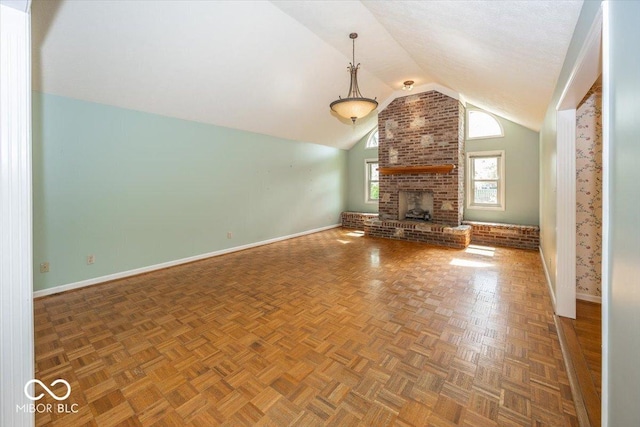 unfurnished living room featuring lofted ceiling, a fireplace, and baseboards