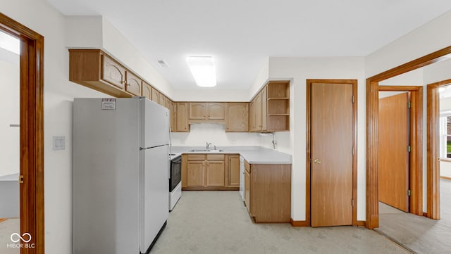 kitchen featuring light countertops, freestanding refrigerator, open shelves, visible vents, and range with electric cooktop