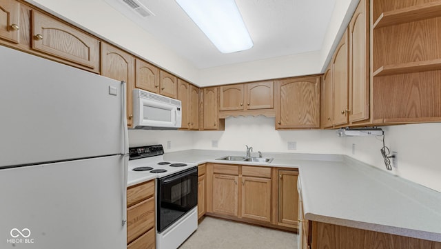kitchen featuring visible vents, open shelves, a sink, light countertops, and white appliances