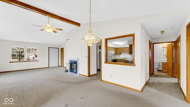 unfurnished living room featuring baseboards, light colored carpet, lofted ceiling with beams, and ceiling fan with notable chandelier