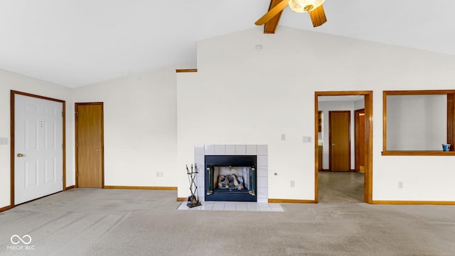 unfurnished living room featuring vaulted ceiling with beams, a ceiling fan, and carpet floors