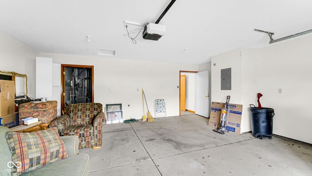 garage with a garage door opener and electric panel
