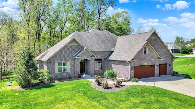 craftsman house featuring a shingled roof, an attached garage, a front lawn, brick siding, and concrete driveway