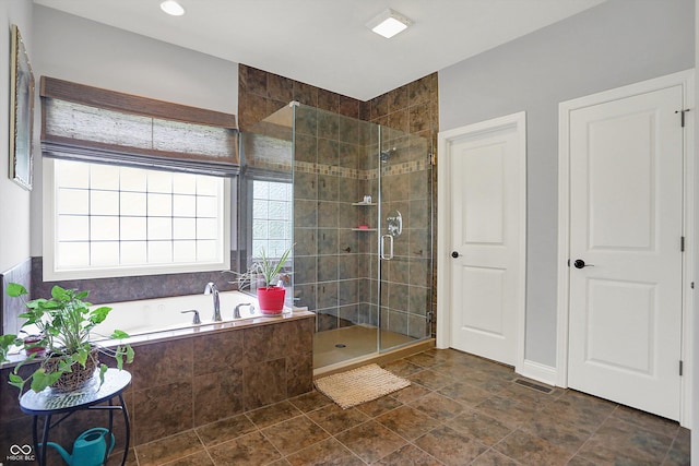 full bath featuring visible vents, a bath, and a shower stall