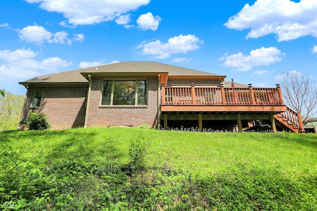 rear view of property with brick siding, a shingled roof, a wooden deck, and stairway