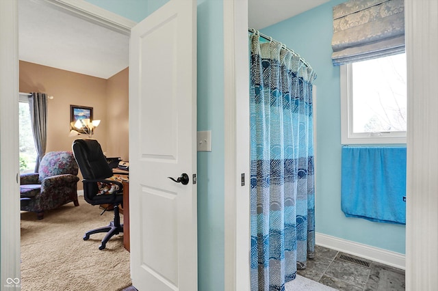 full bathroom featuring visible vents, baseboards, and a shower with curtain