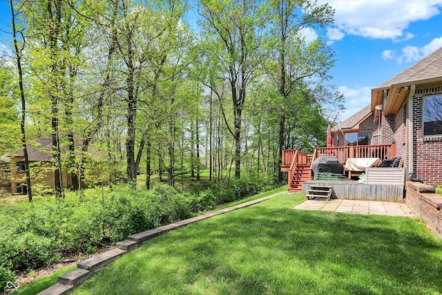 view of yard featuring a wooden deck and stairs