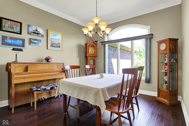 dining room featuring baseboards, a notable chandelier, ornamental molding, and dark wood-type flooring