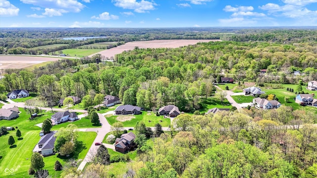 drone / aerial view with a view of trees and a residential view
