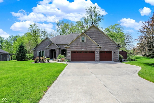 craftsman-style house with brick siding, driveway, a front yard, and a garage