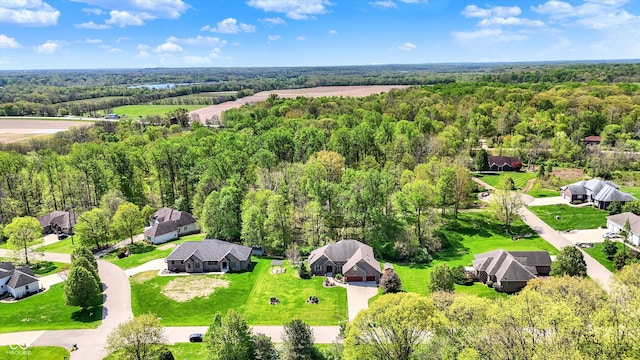 aerial view featuring a view of trees and a residential view