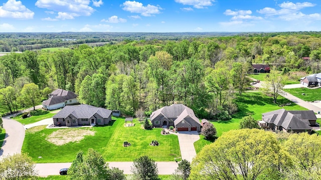 aerial view featuring a wooded view