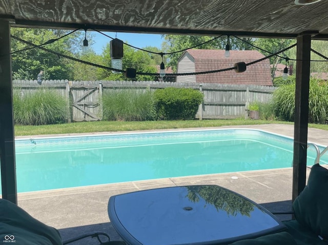 view of swimming pool featuring a fenced backyard and a fenced in pool