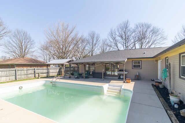view of pool with a patio area, a fenced backyard, and a fenced in pool