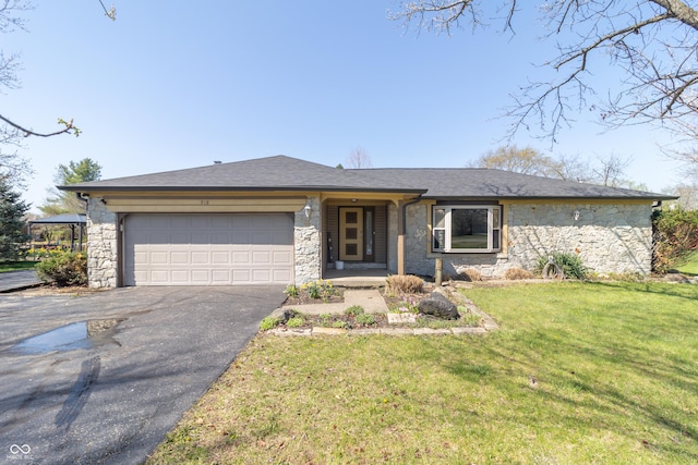 view of front of home with roof with shingles, a front yard, stone siding, an attached garage, and driveway