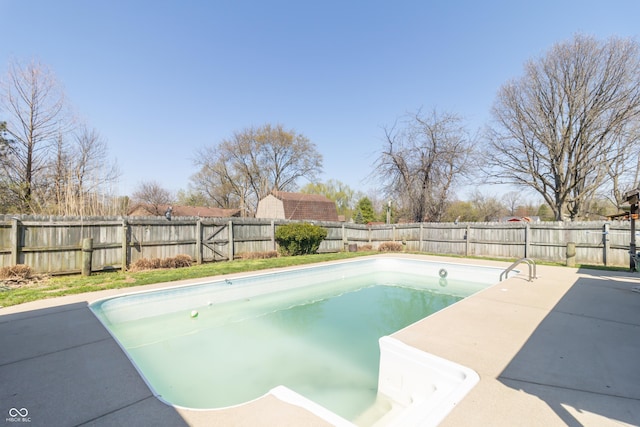 view of pool featuring a fenced backyard, a fenced in pool, and a patio