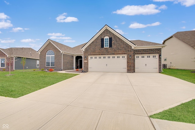 3799 Hoosier Down Dr, Bargersville, IN 46106 - view of front facade featuring a shingled roof, a front lawn, concrete driveway, brick siding, and a garage