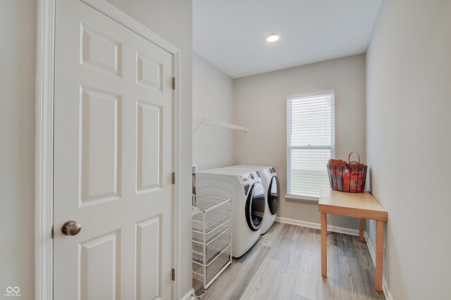 3799 Hoosier Down Dr, Bargersville, IN 46106 - clothes washing area with baseboards, light wood-style flooring, laundry area, and separate washer and dryer