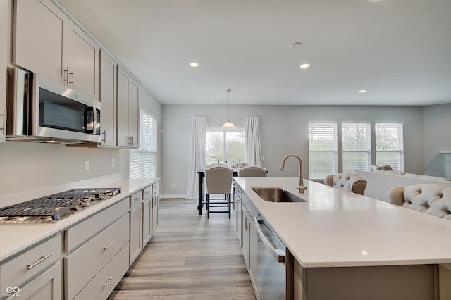 3799 Hoosier Down Dr, Bargersville, IN 46106 - kitchen with a sink, stainless steel appliances, light wood finished floors, light countertops, and recessed lighting