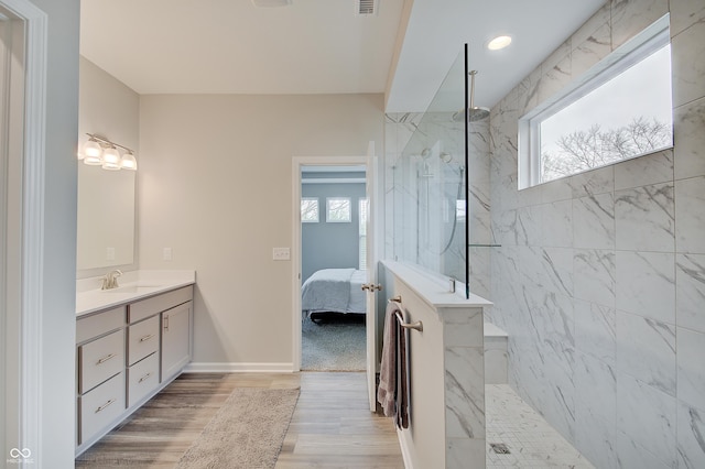 3799 Hoosier Down Dr, Bargersville, IN 46106 - ensuite bathroom with vanity, wood finished floors, a marble finish shower, and plenty of natural light