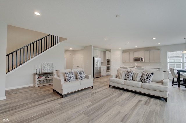 3799 Hoosier Down Dr, Bargersville, IN 46106 - living area with baseboards, recessed lighting, light wood-style floors, and stairway