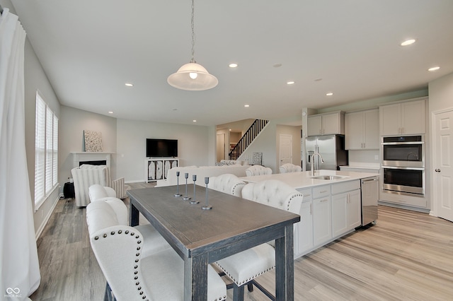 3799 Hoosier Down Dr, Bargersville, IN 46106 - kitchen with a sink, open floor plan, light wood-type flooring, stainless steel appliances, and recessed lighting