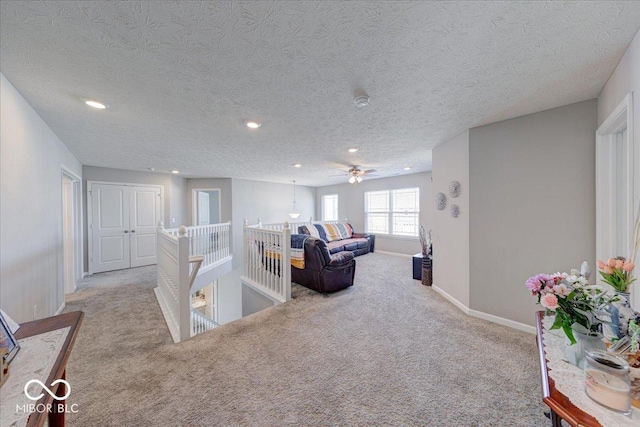 5839 Altar Bell Cir, Greenwood, IN 46143 - carpeted living area featuring recessed lighting, baseboards, and a textured ceiling