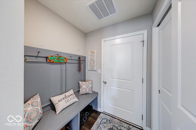 5839 Altar Bell Cir, Greenwood, IN 46143 - mudroom with visible vents and dark wood finished floors