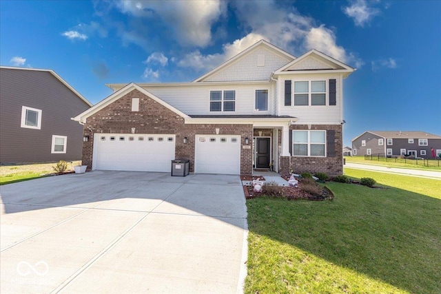 5839 Altar Bell Cir, Greenwood, IN 46143 - view of front of home with brick siding, an attached garage, a front yard, and concrete driveway