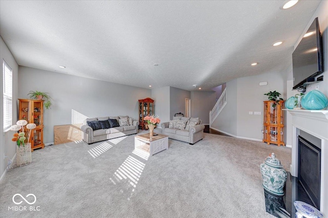 5839 Altar Bell Cir, Greenwood, IN 46143 - living area with carpet floors, baseboards, a fireplace, and stairway