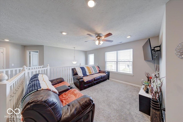 5839 Altar Bell Cir, Greenwood, IN 46143 - carpeted living area with recessed lighting, a textured ceiling, ceiling fan, and baseboards