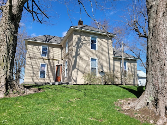 2628 N 150 E, Rushville, IN 46173 - rear view of house featuring a yard and a chimney