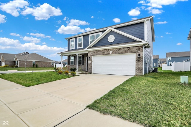 view of front of property with brick siding, a front lawn, covered porch, and concrete driveway