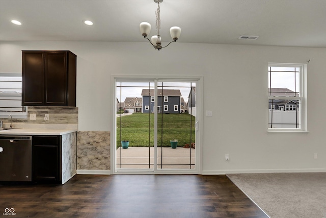 unfurnished dining area with visible vents, baseboards, an inviting chandelier, dark wood-style floors, and recessed lighting