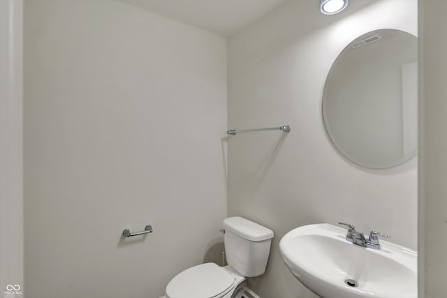bathroom featuring a sink and toilet