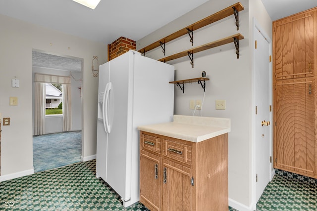 kitchen with open shelves, light countertops, tile patterned floors, white fridge with ice dispenser, and carpet