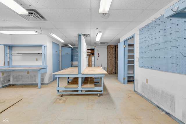 kitchen featuring visible vents, a paneled ceiling, and tile patterned floors