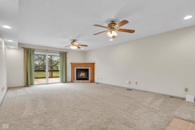 unfurnished living room with recessed lighting, ceiling fan, and carpet