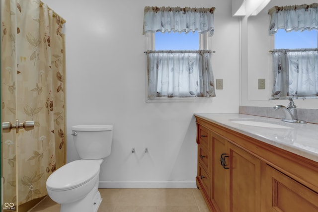 full bathroom featuring baseboards, a wealth of natural light, toilet, and vanity