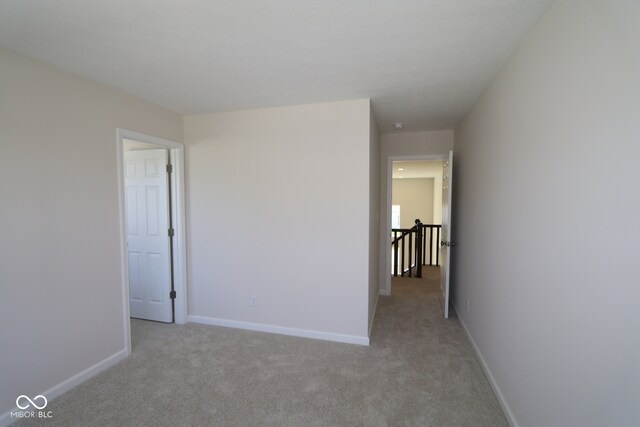 10543 Banyan Wood Ct, Indianapolis, IN 46239 - spare room featuring light carpet and baseboards