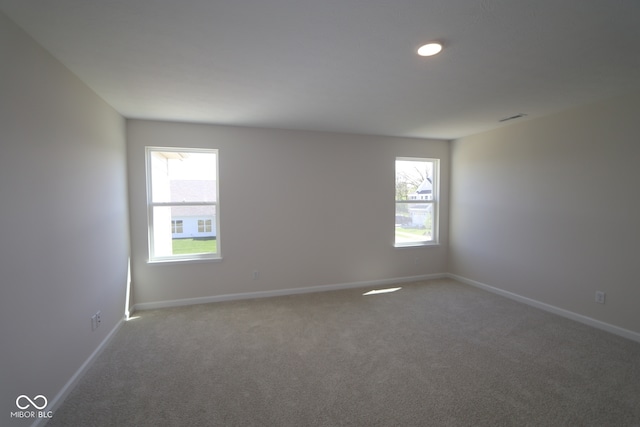 10543 Banyan Wood Ct, Indianapolis, IN 46239 - carpeted empty room with plenty of natural light, baseboards, and recessed lighting