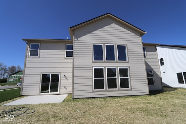 10543 Banyan Wood Ct, Indianapolis, IN 46239 - back of property with a patio and a lawn