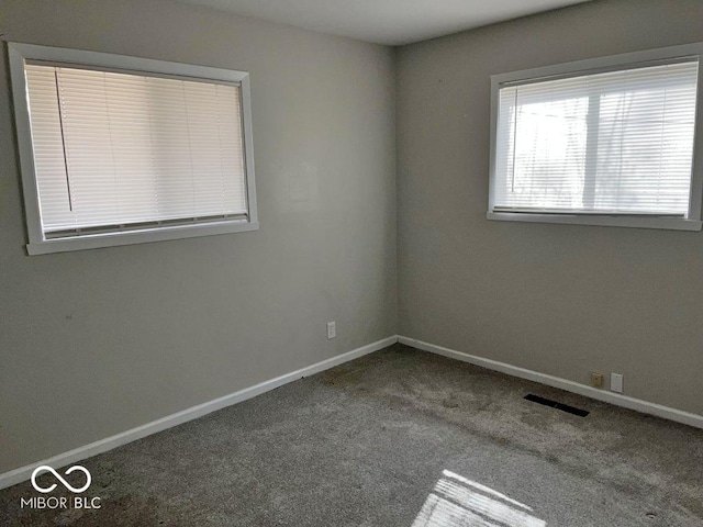 2260 N Graham Ave, Indianapolis, IN 46218 - carpeted empty room with baseboards