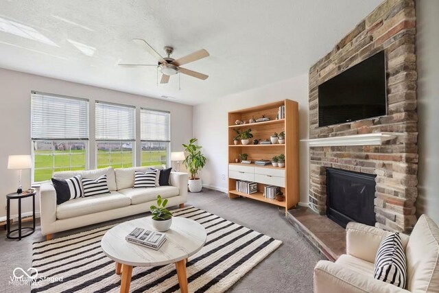 6681 Keepsake Dr, Whitestown, IN 46075 - living room with ceiling fan, a large fireplace, and carpet