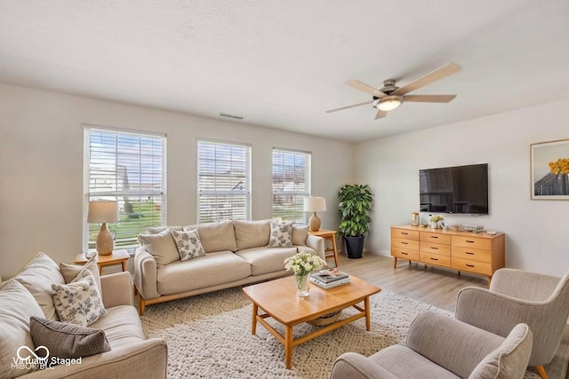 6681 Keepsake Dr, Whitestown, IN 46075 - living area featuring a ceiling fan and light wood-type flooring