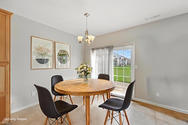 6681 Keepsake Dr, Whitestown, IN 46075 - dining room with a chandelier and light tile patterned flooring