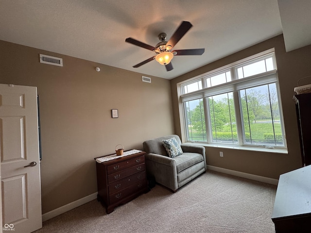 20971 Shoreline Ct Unit 214, Noblesville, IN 46062 - sitting room with visible vents, baseboards, ceiling fan, and light colored carpet