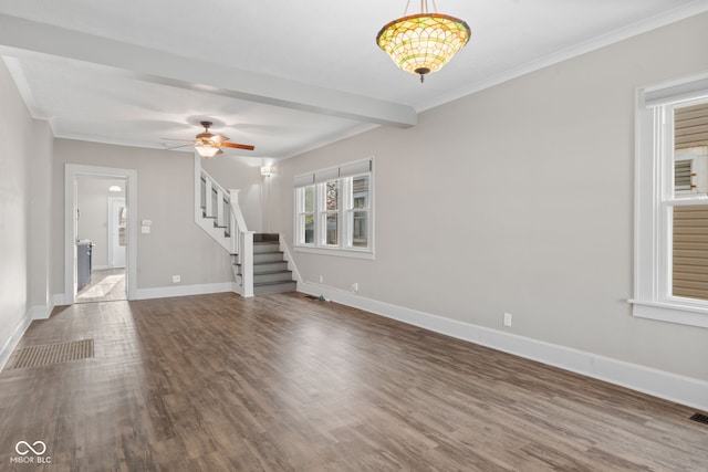 601 Wallace Ave, Indianapolis, IN 46201 - unfurnished living room featuring baseboards, wood finished floors, and stairs